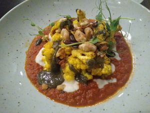 Baked cauliflower on tomato and bean cream at Bistro Maha in Ljubljana