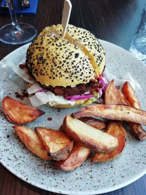 Chickpea burger with mixed fries at Bistro Maha in Ljubljana