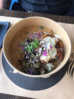 Warm bowl with tempeh, vegetables and a stew at Bistro Maha in Ljubljana