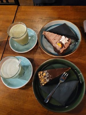 Below: cheesecake above: orange chocolate cake  and 2 matchas at LYR Speciality Coffee and Food in Pecs