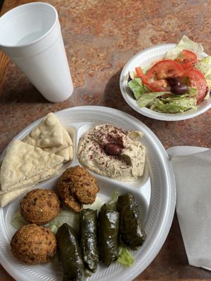 Combo plate with Dolmas and falafel and side of hummus 😋  at Aladdin's Cafe - 32nd Ave in Fargo