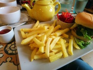 One of the household staples the Ch'kun Burger with incl. options of fries, sweet potato fries or salad, complimentary ketchup/mayo and coleslaw at The Peppercorn in Huddersfield