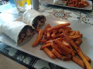 Chick'un and facon ceasar salad wrap with sweet potato fries at The Peppercorn in Huddersfield