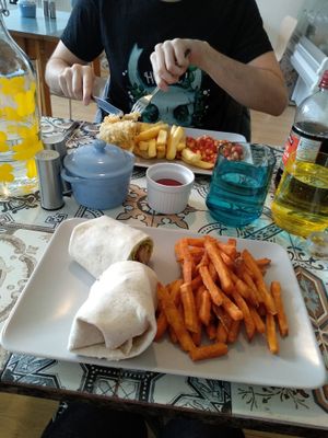 Chick'un & facon Cesar wrap with sweet potato fries & f'sh and chips with chips and baked beans. at The Peppercorn in Huddersfield
