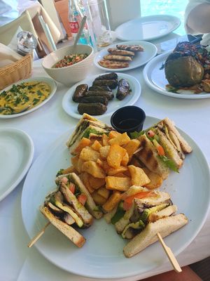 Fava bean dip, tabluleh, stuffed vine leaves, pitta, stuffed pepper, vegan club sandwich   at Talos Restaurant in Crete
