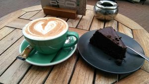 Lovely vegan chocolate cake and a dirty chai latte with oat milk   at Anne&Max in Arnhem
