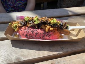 Vegan pink hot dog. Topped with mushrooms, avocado, beans and crispy onions. The bun is a beautiful pink from natural beetroot dye. The dog itself was delicious 😋  at Pom Kitchen - Sharrow in Sheffield