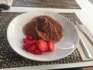 Pancake with vegan nutella & strawberries.  at Local - Your Healthy Kitchen in Cascais