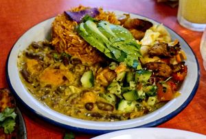 Hot plate with jollof rice and curries at Jah Jah in Paris