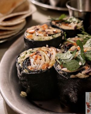 Raw maki rolls served with peanut and coconut sauce at Jah Jah in Paris