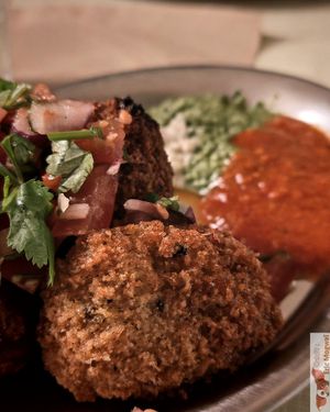 Akara: Fried black-eyed pea fritters served with spicy tomato sauce, cilantro chutney, and cashew cream.

 at Jah Jah in Paris