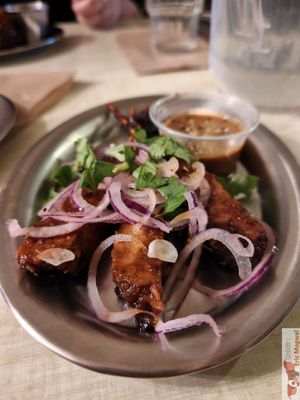 Tempeh skewers served with peanut sauce and pickled onions at Jah Jah in Paris
