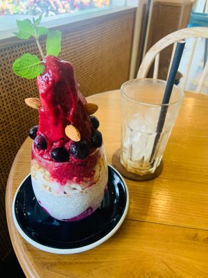 Chia pudding with berry sorbet and a empty Glas of caramel latte at Beach Bowl in Legian