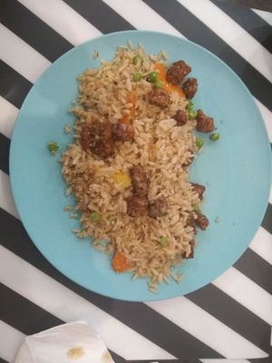 Brown rice with protein chunks and satay sauce at El Enano Verde in Torremolinos