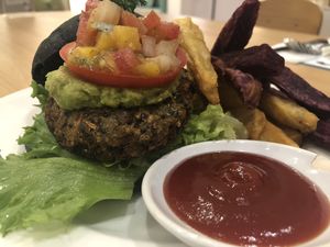 Broccoli Quinoa Charcoal Burger with sweet potato fries at Broccoli Revolution - Central Embassy in Bangkok