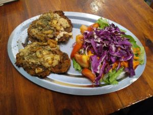 Milanesa con queso y champ at La Reverde Parrillita Vegana in Buenos Aires