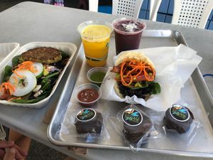Lunch box with lentil pattie, karina special, #3 smoothie, ginger,turmeric,orange juice, and EPIC vegan cookie (taste like a Twix). at Arepas To Go & More -  - Aguadilla 110 - Food Truck in Aguadilla