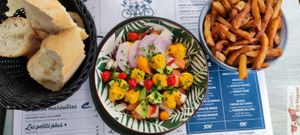 Buddha Bowl, red quinoa, melon, nectarine, avocado, drop of peppers, radish, lemon hummus, chickpeas, chives at Le Tandem in Biarritz