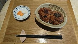 Fermented Brown Rice Ball (2 pieces with pickles) ¥500. Takeout is also available. at Sarasya Shinsen Chaen in Tokyo