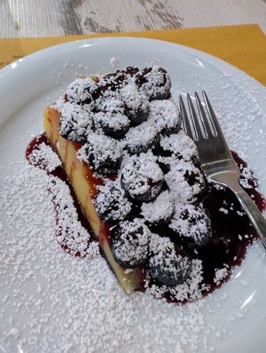 Tofu cake is just like flan with grapes and a little chocolate sauce at Nirvana in Florence