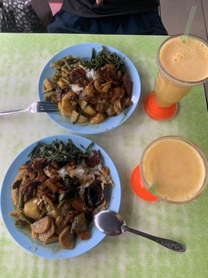 30rm 12nz $ for 2 huge plates and 2 orange juice   at Liew Chai Vegetarian in Kota Kinabalu