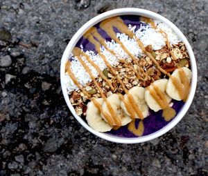 Our most popular smoothie bowl - The Berry Bowl! Topped with Our famous granola, shredded coconut, banana slices, and peanut butter drizzle! at My Fit Little Foodie in Georgetown