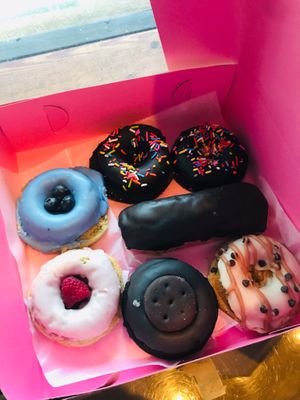 standard variety box! fudge donuts w/ sprinkles, blueberry lemon, raspberry vanilla, thin mint, vanilla chocolate chip, and a long jane! at Move That Dough Baking Co. in Charlotte