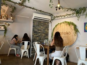 Small indoor dining room or large patio for people who like to eat smog.  at Katako Veg in Santiago
