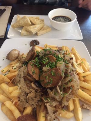 Chorillana and fried tofu with teriyaki sauce  at Katako Veg in Santiago