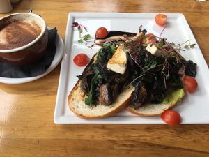 Gucc-a-vegan special. Mushrooms, spinach, avo and tofu on sourdough.  at Reflections Restaurant in Lake Tekapo