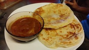 Roti canai/praha with curry at Indah Cafe in Kuching