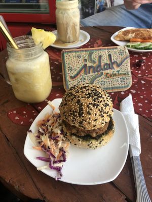 Vegan burger and pineaple, lime, coconut smoothie at Indah Cafe in Kuching
