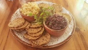 Almond Chevre cheese with olive tapande served with crackers at Surya Cafe in Fitchburg