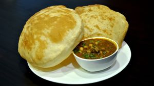 A vegan chickpea curry with fried bread.  at Mithai Indian Cafe in Cary