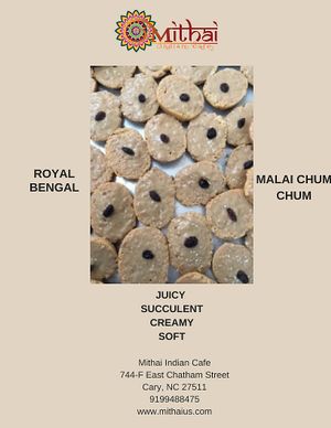 Milk sweet with cream and a raisin on top at Mithai Indian Cafe in Cary