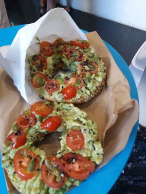 Bagel with avocado, cherry toms wirh sunflower seeds at Smoothme Superfood Bar in Melbourne