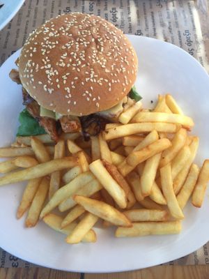 bbq jack fruit in a bun with vegan cheese and fries at Evilion Bistro in Crete