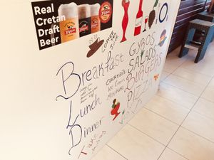 Menu on the wall at Evilion Bistro in Crete