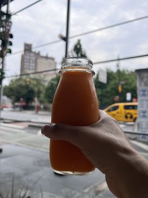 Orange carrot fresh pressed juice   at The Butcher's Daughter - West Village in New York City