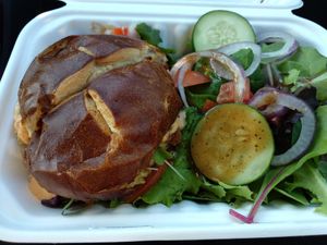 Crab burger on a pretzel roll at Three Girls Vegan Creamery - Boston in Guilford