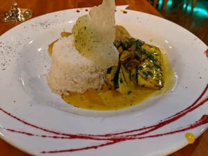 Ecuadorian curry with patacones. at El Jardin in Puerto Ayora