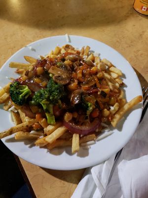 Curry poutine (with a funky pineapple sauce - so good!!) at Taps Brewhouse & Grill in Niagara Falls