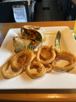 Veggie wrap with vegan onion rings   at Taps Brewhouse & Grill in Niagara Falls