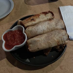 Vegan pizza rolls (comes with 6)  at Taps Brewhouse & Grill in Niagara Falls