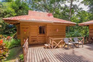One of our two person queen-bungalow villas sleeps two and is in the heart of our jungle gardens. It has a private bath and even a small kitchen.  Our property is on a beautiful river, and has a newly refurbished outdoor pool for rejuvenation every day of the year (it's never cold in Costa Rica).  at El Mono Feliz in Ojochal De Osa