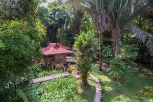 Our bungalow villas nestled in the heart of our jungle gardens. each has a private bath and even a small kitchen.  Our property is on a beautiful river, and has a newly refurbished outdoor pool for every day of the year (it's never cold in Costa Rica).  at El Mono Feliz in Ojochal De Osa