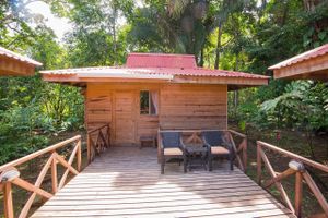 Our four-person family-suite-bungalow villas sleeps four and is in the heart of our jungle gardens. It has a private bath and even a small kitchen. Our property is on a beautiful river, and has a newly refurbished outdoor pool for rejuvenation every day of the year (it's never cold in Costa Rica). 
 at El Mono Feliz in Ojochal De Osa
