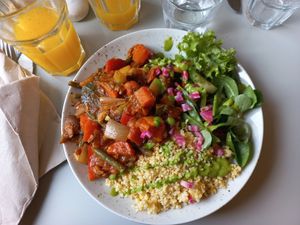 African stew served with millet and side salad at Glow in Luxembourg City