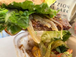 half eaten Tempeh burger at Chef Tanya's Kitchen in Palm Springs