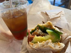 Half eaten chicken sandwich and Iced Tea. at Chef Tanya's Kitchen in Palm Springs